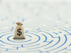 Drawing of circular maze with a bag of money at its center